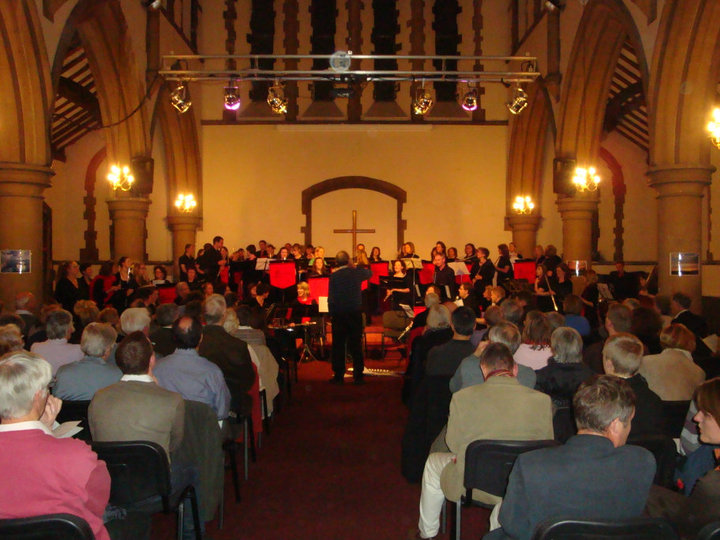 Past and present members performing at the concert conducted by Robin Soldan